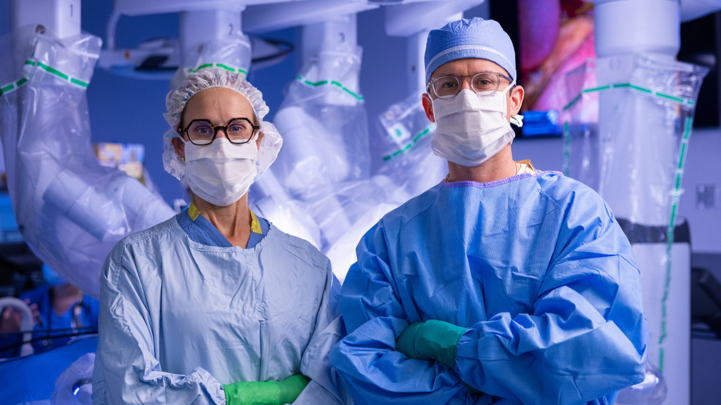 Dr. Annie Kulungowski (left) and Dr. Jonathan Hills-Dunlap (right) are surgeons at Children's Hospital Colorado who use robotic-assisted surgery to perform bariatric procedures.