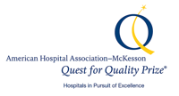 McKessen Quest for Quality Logo A logo of a blue circle with a curved yellow line and the words American Hospitality Association - McKesson Quest for Quality Prize.
