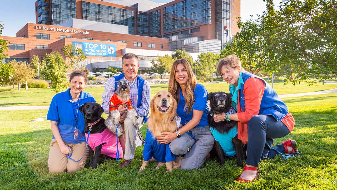 Prescription pets and their owners pose at Children’s Hospital Colorado in Aurora.