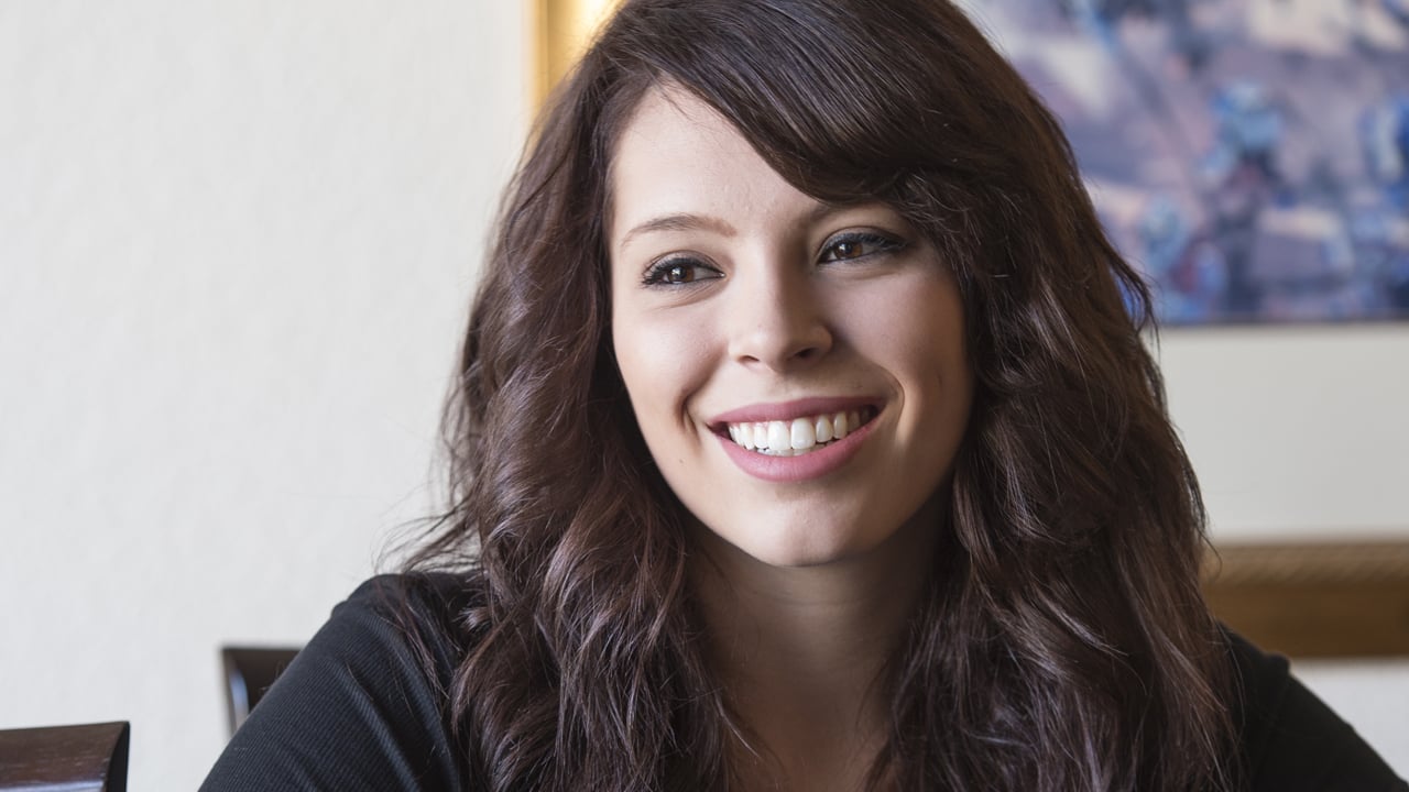 Alexa, biliary atresia patient at Children's Hospital Colorado, has long brown hair and is smiling.