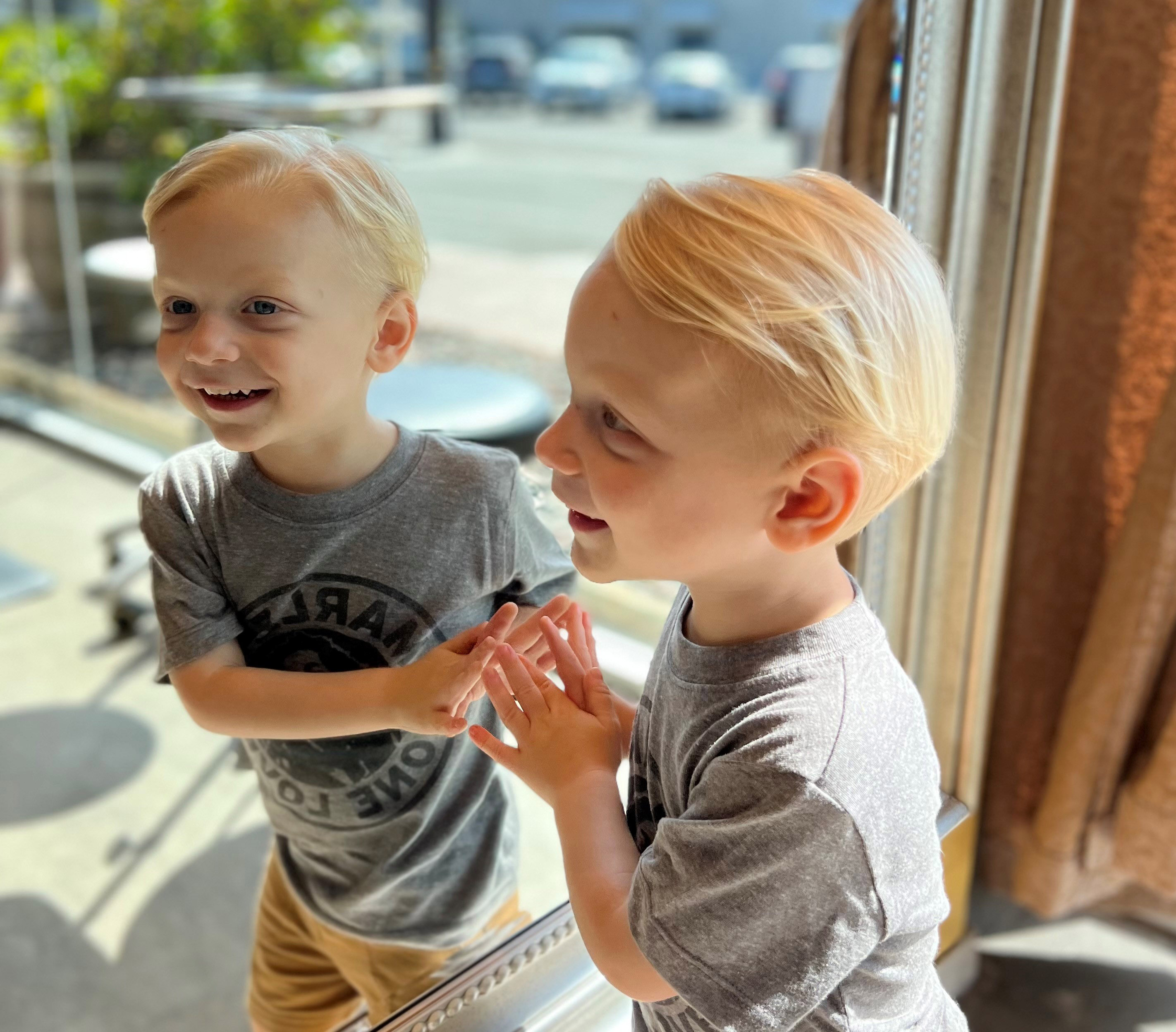 Everett looks at his reflection in the mirror.