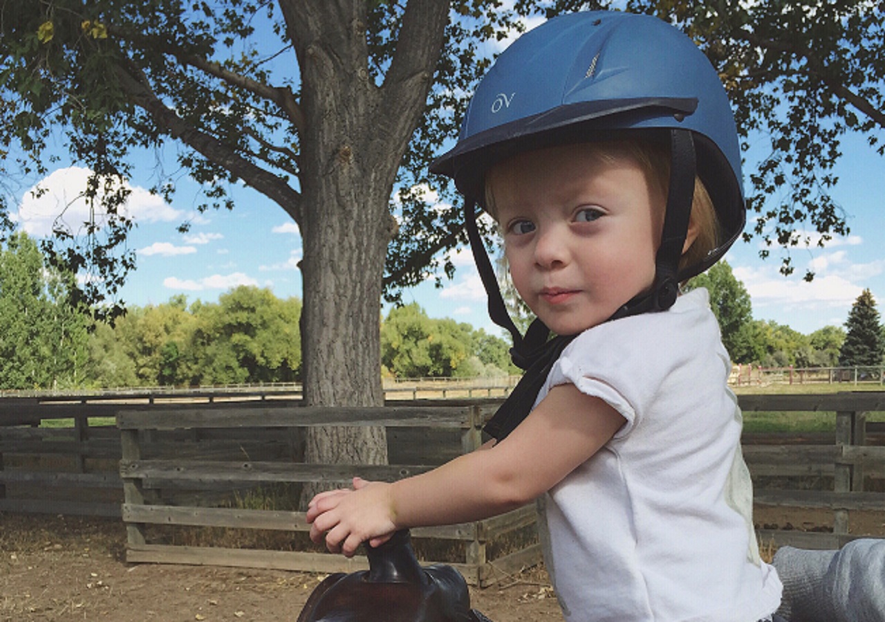 Harlowe, a young girl treated by Dr. Bettina Cuneo at Children's Hospital Colorado, rides a horse.