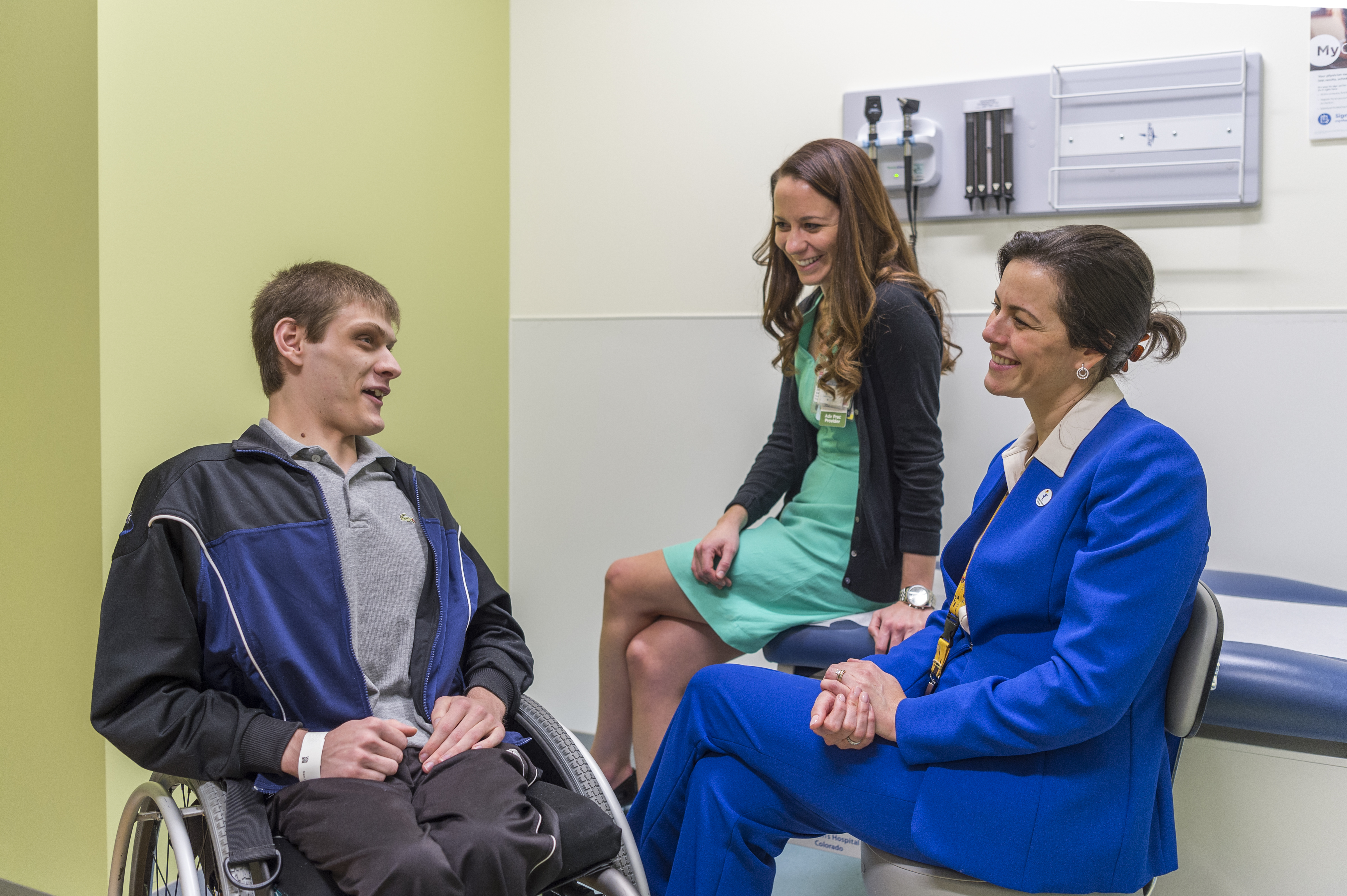 Jonathan Mackey in exam room with Dr. Andrea Bischoff and Julie Schlekter, nurse practitioner