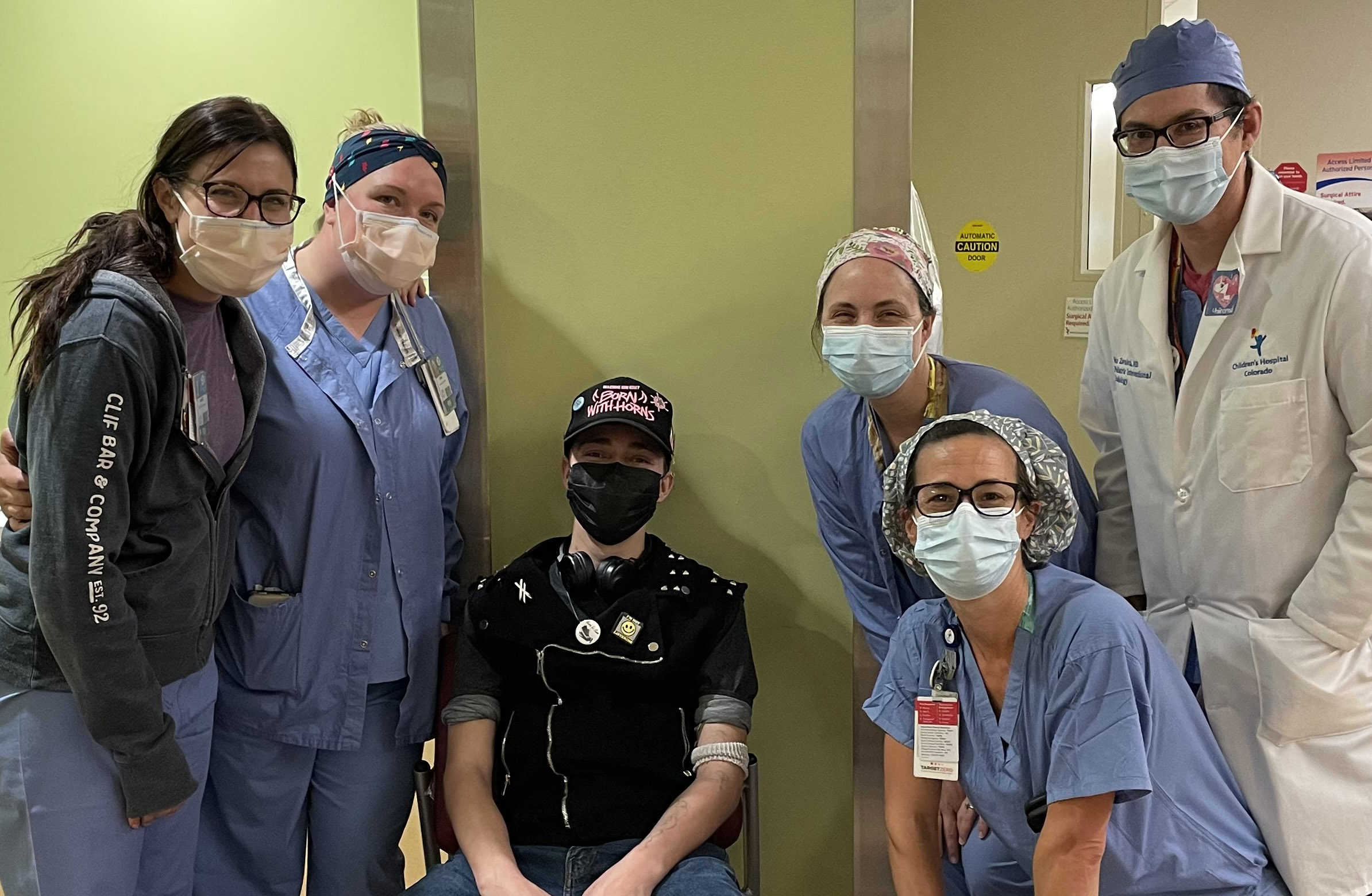 Seth poses with his nurses and surgeons.