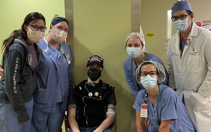 Seth poses with his nurses and surgeons.