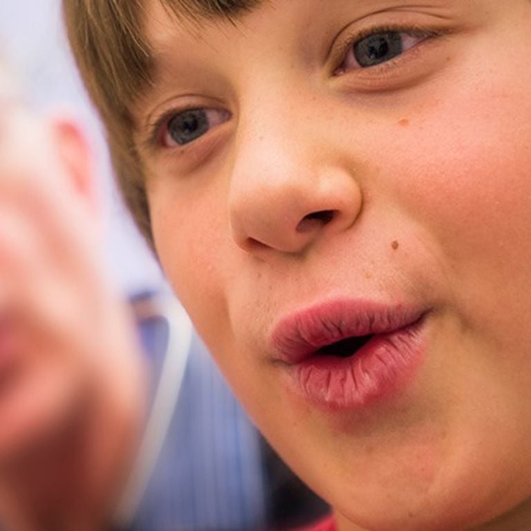 Child breathing with a doctor