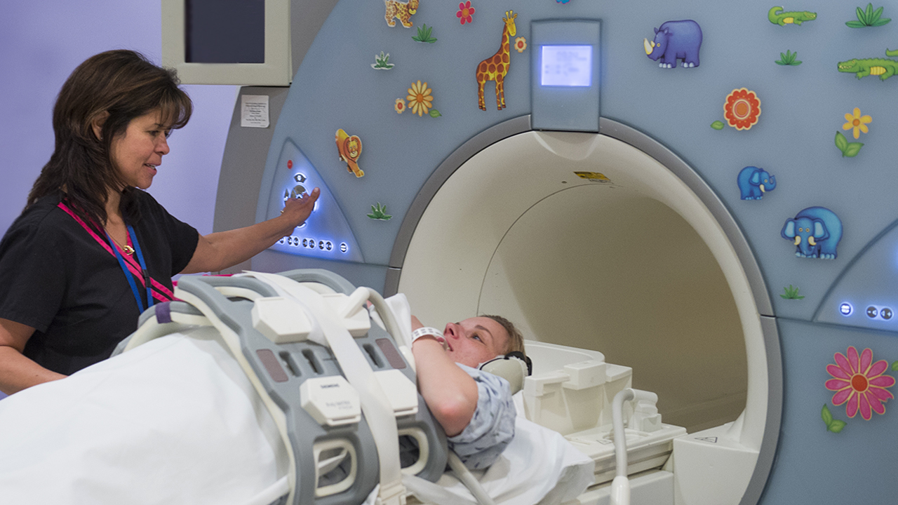 A woman enters the fetal MRI machine