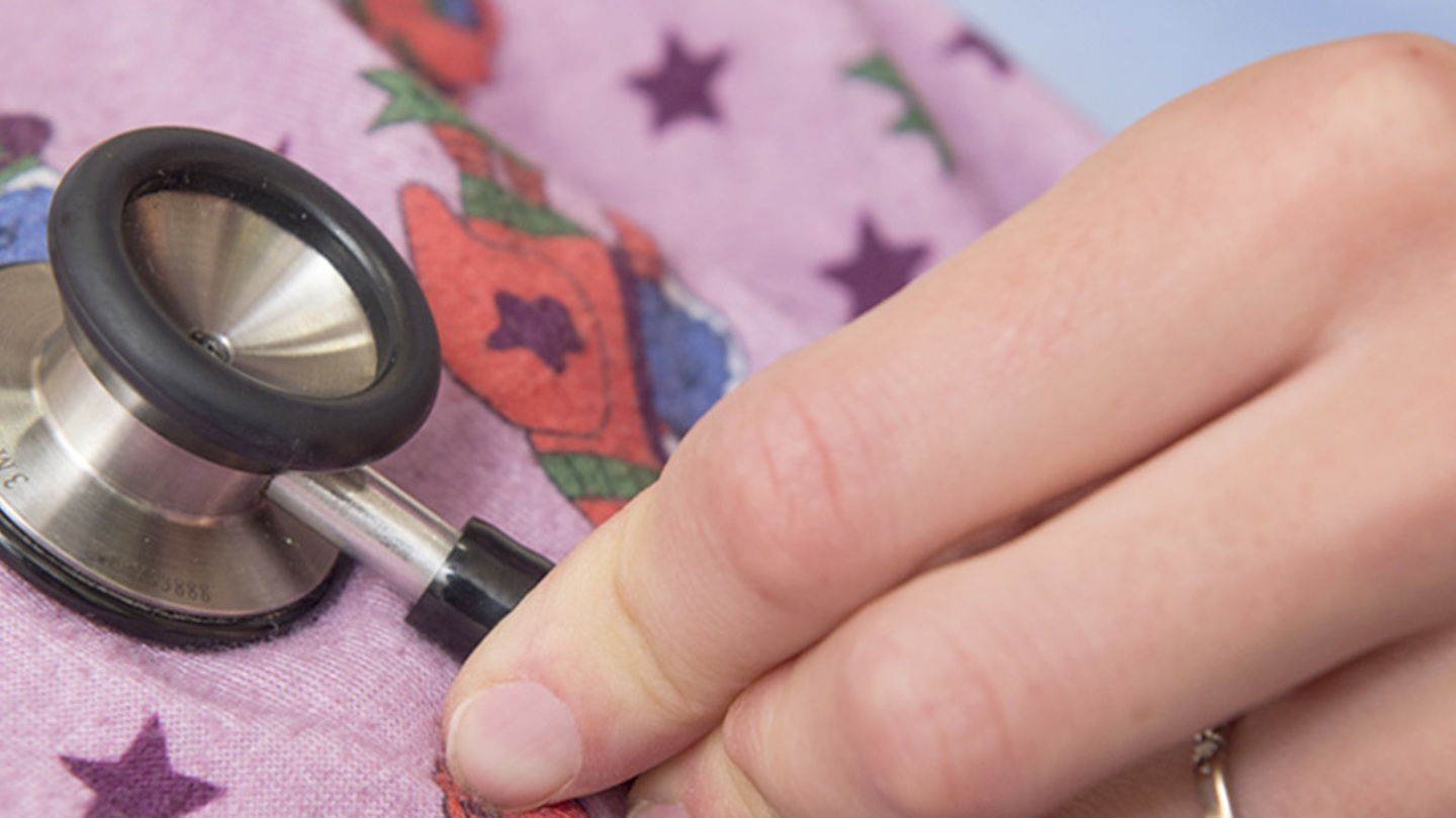 A close-up of a stethoscope on a patient's chest.