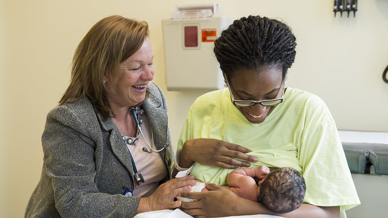 A woman breastfeeding her baby