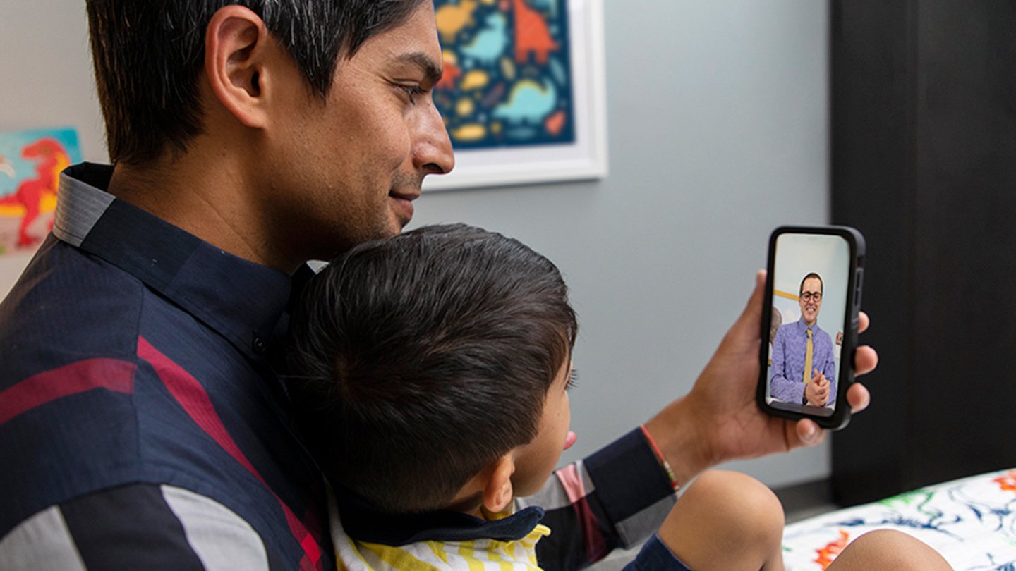 Parent and child on a telehealth appointment.