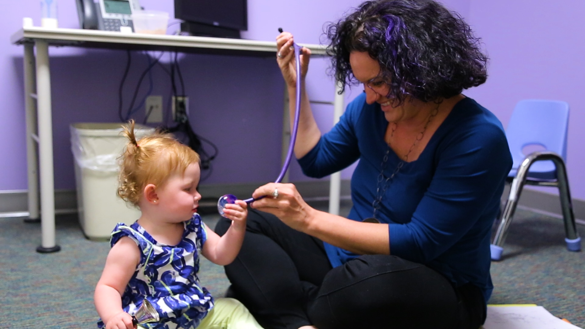 Dr. Nicole Tartaglia meets with a young patient.