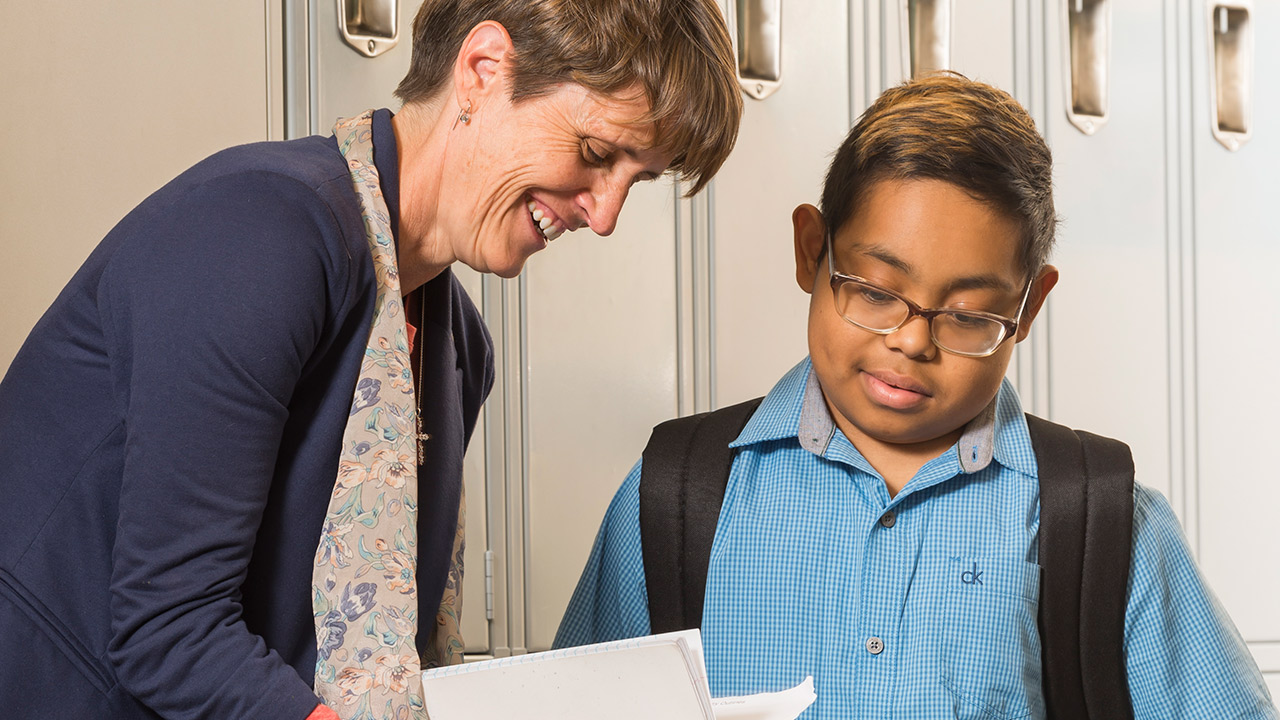 Adrian Francisco (right) and his kidney donor, Jaime Bailey (left). After 10 years on dialysis, Adrian is adapting to full-time school for the first time.