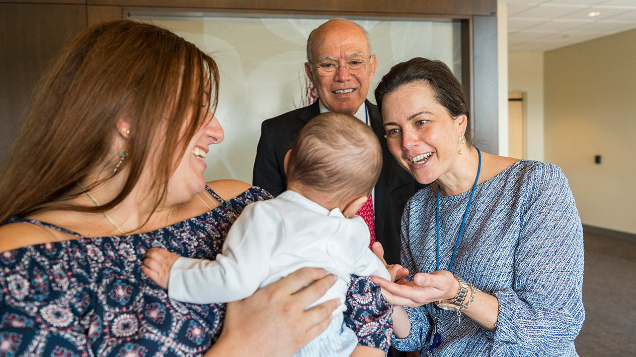 Pediatric colorectal surgeons Andrea Bischoff, MD, and Alberto Peña, MD, meet Linda Sibilia’s son, Benjamin Nieto. Linda was born with a urogenital malformation called cloaca, which Dr. Peña reconstructed 30 years ago.