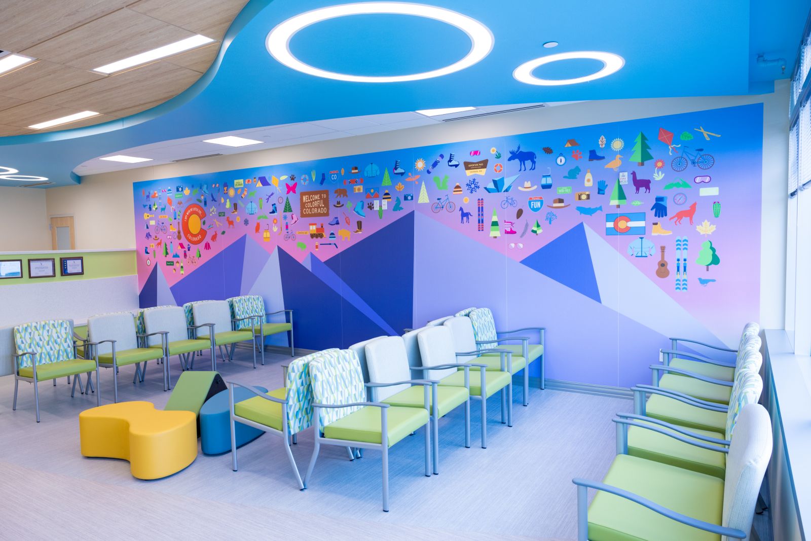 Colorful inside waiting room with rows of chairs 