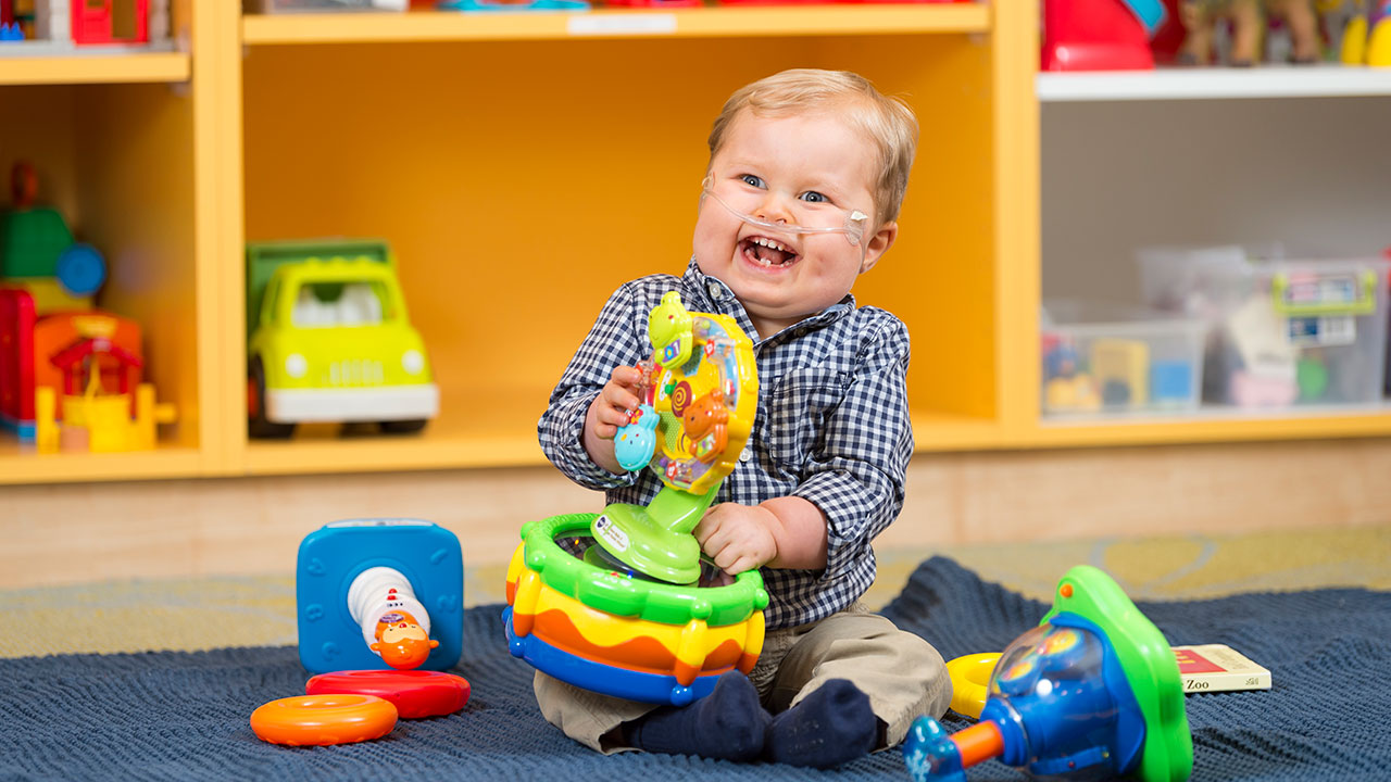 Baby playing in kids area at Children’s Colorado