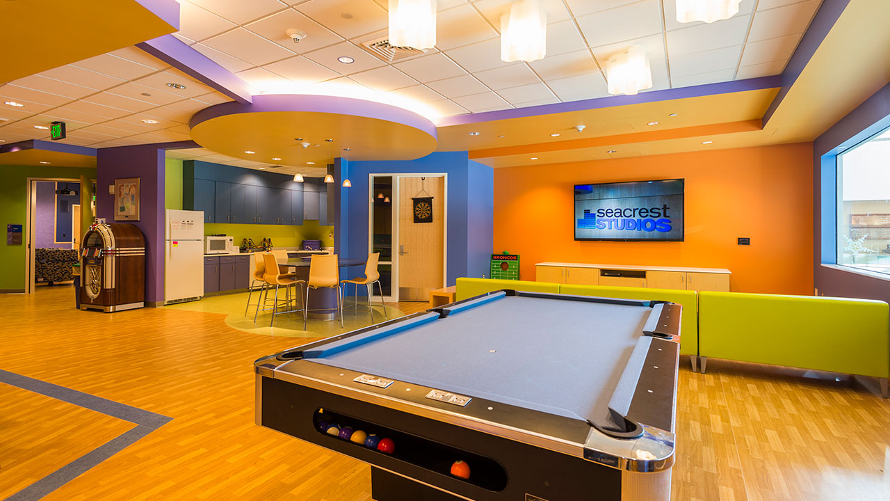 Pool table and lounge in the Teen Zone at Children’s Colorado