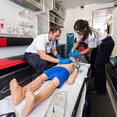 The EMS team at Children's Hospital Colorado practices treatment on a computerized mannequin patient.