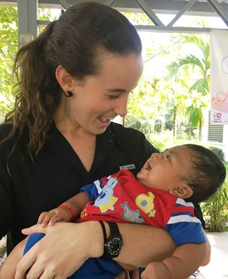 A woman holds a baby at the Trifinio Center for Human Development in Guatemala.