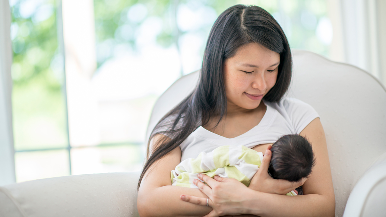 Mother breastfeeding her baby.