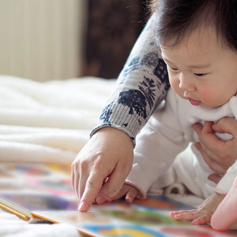 Baby reading a book