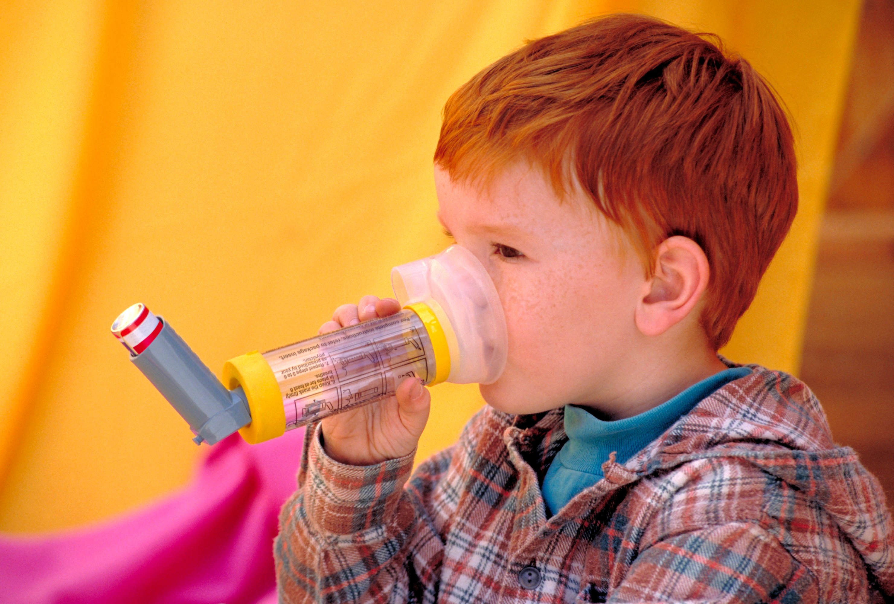 A child uses a nebulizer to help his breathing.