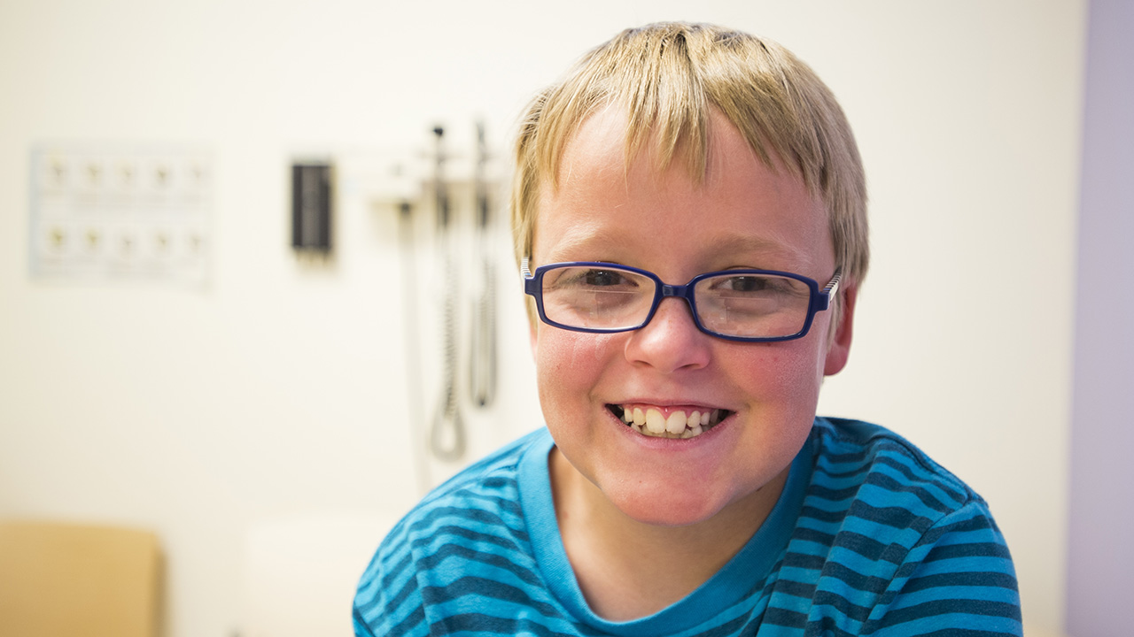 child in doctor's office smiling