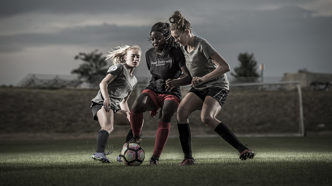 Girls playing soccer.