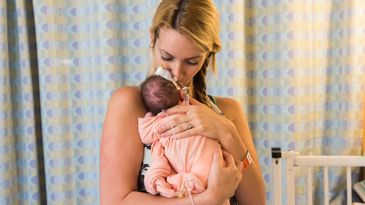 Mother with baby in NICU