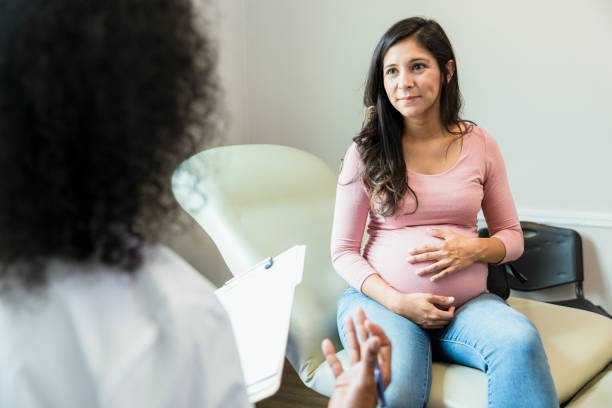 Pregnant woman talking to provider