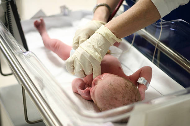 Newborn being examined by doctor