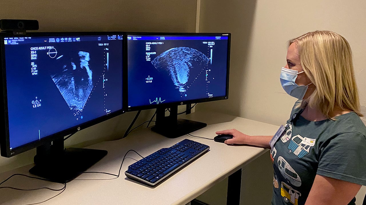 Woman looking at computer screens