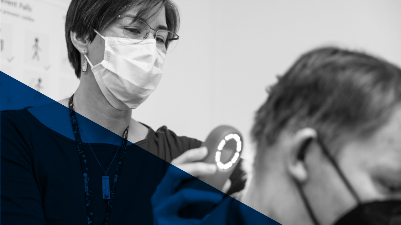 Doctor scanning back of patient's neck