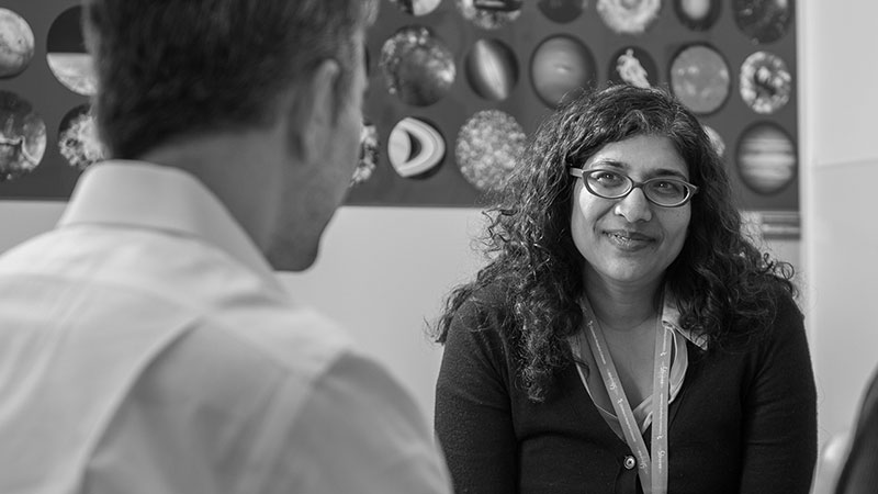 Dr Vemulakonda talking with a patient