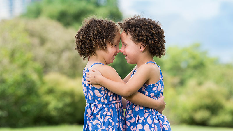 Twins hugging each other