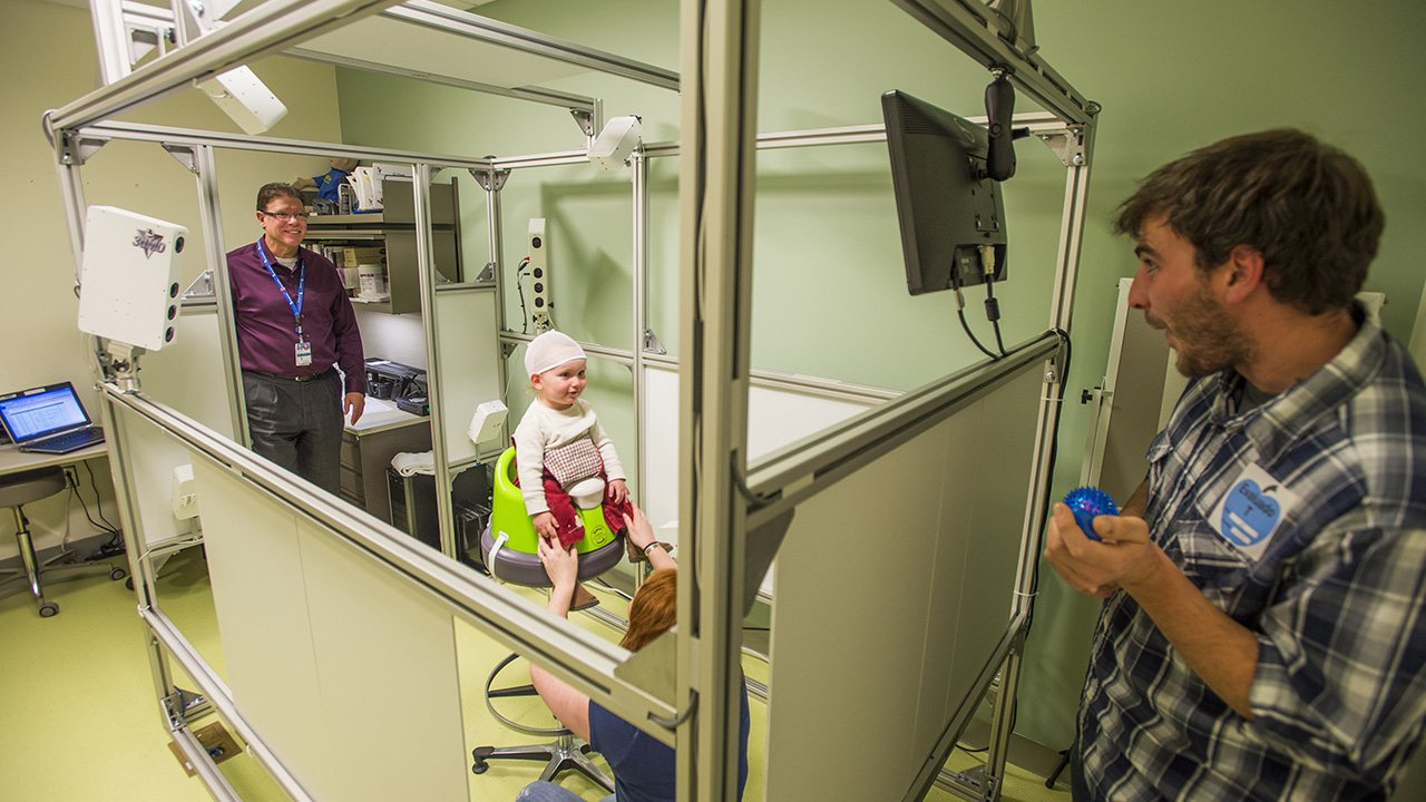 The Children's team performs a head scan on a young toddler