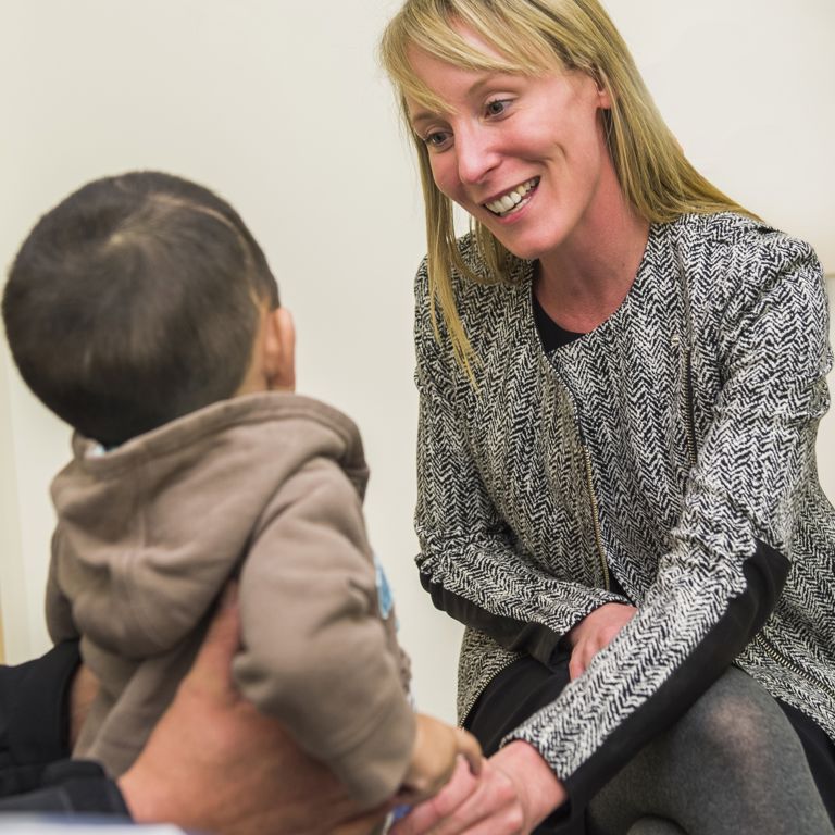 A craniofacial specialists examines a child.